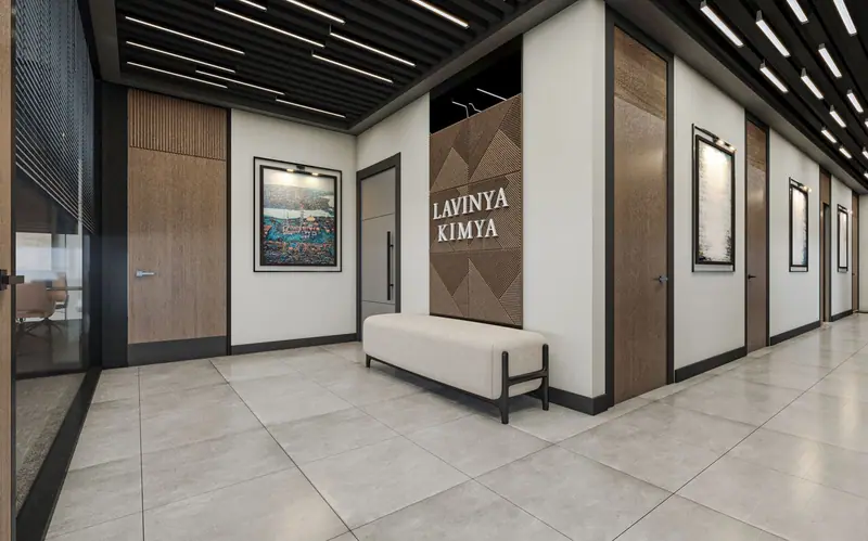 Lavinya Kimya ofisinde bekleme bankı ve lineer aydınlatmalı, sakin paletli giriş holü